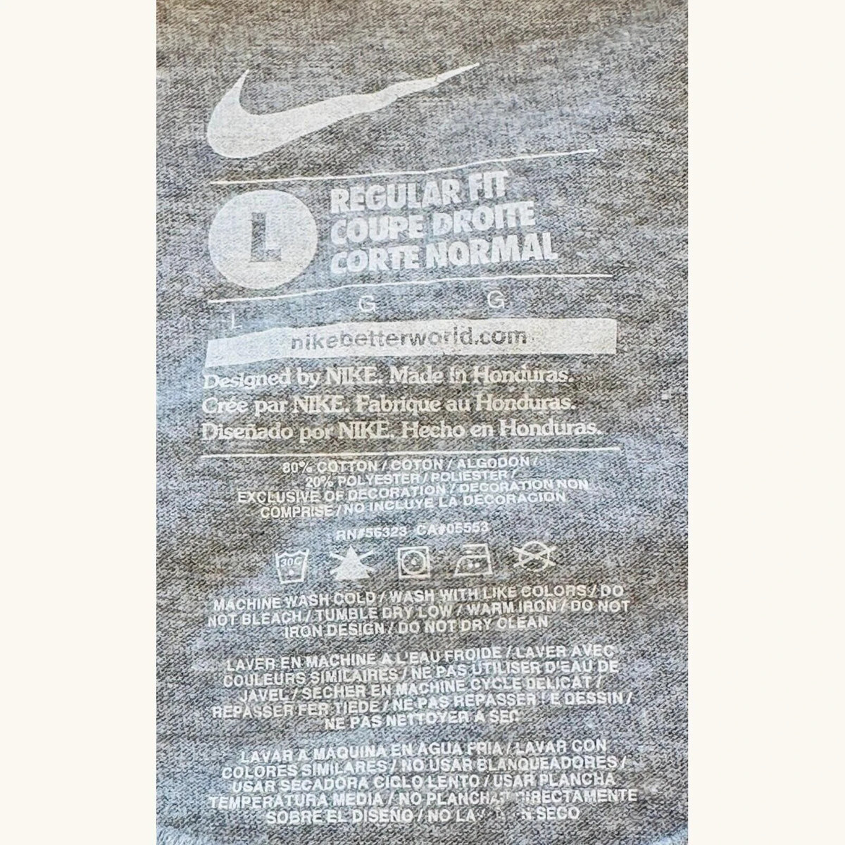 Nike grey long sleeve top featuring Dallas Cowboys star graphic print on soft knit fabric.