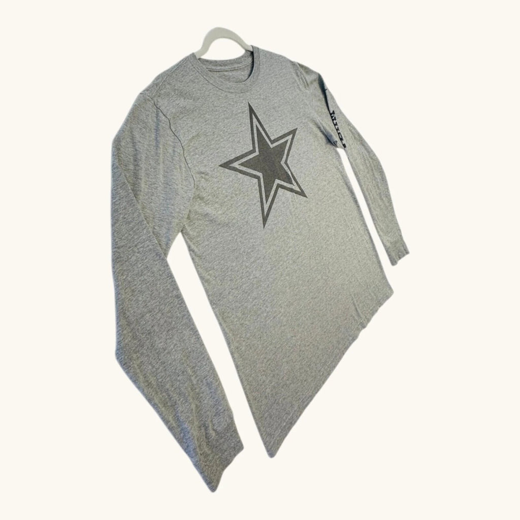 Nike grey long sleeve top featuring Dallas Cowboys star graphic print on soft knit fabric.