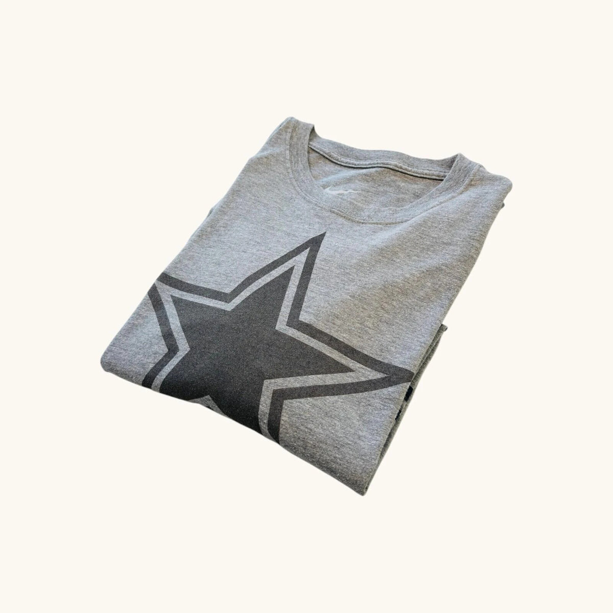 Nike grey long sleeve top featuring Dallas Cowboys star graphic print on soft knit fabric.