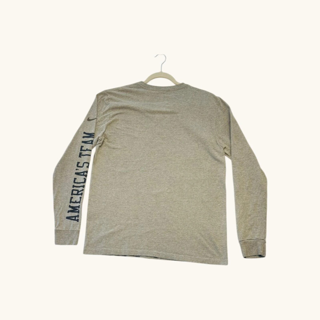Nike grey long sleeve top featuring Dallas Cowboys star graphic print on soft knit fabric.