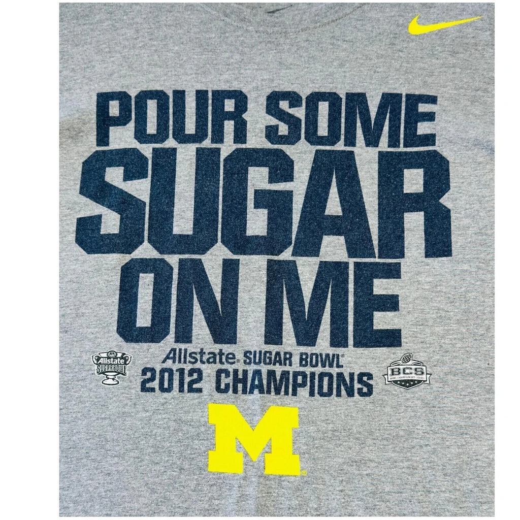 Nike grey Michigan Wolverines t-shirt with bold graphic print and yellow swoosh logo.
