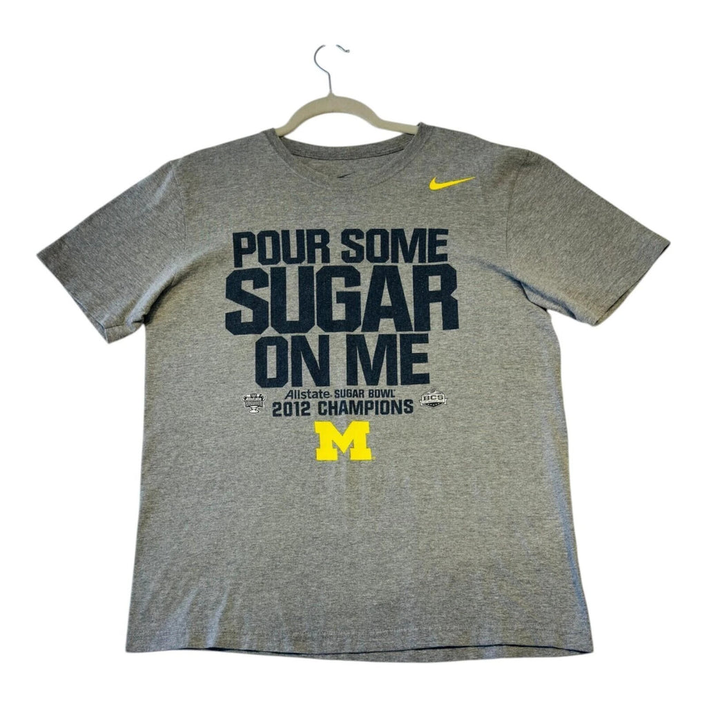 Nike grey Michigan Wolverines t-shirt with bold graphic print and yellow swoosh logo.