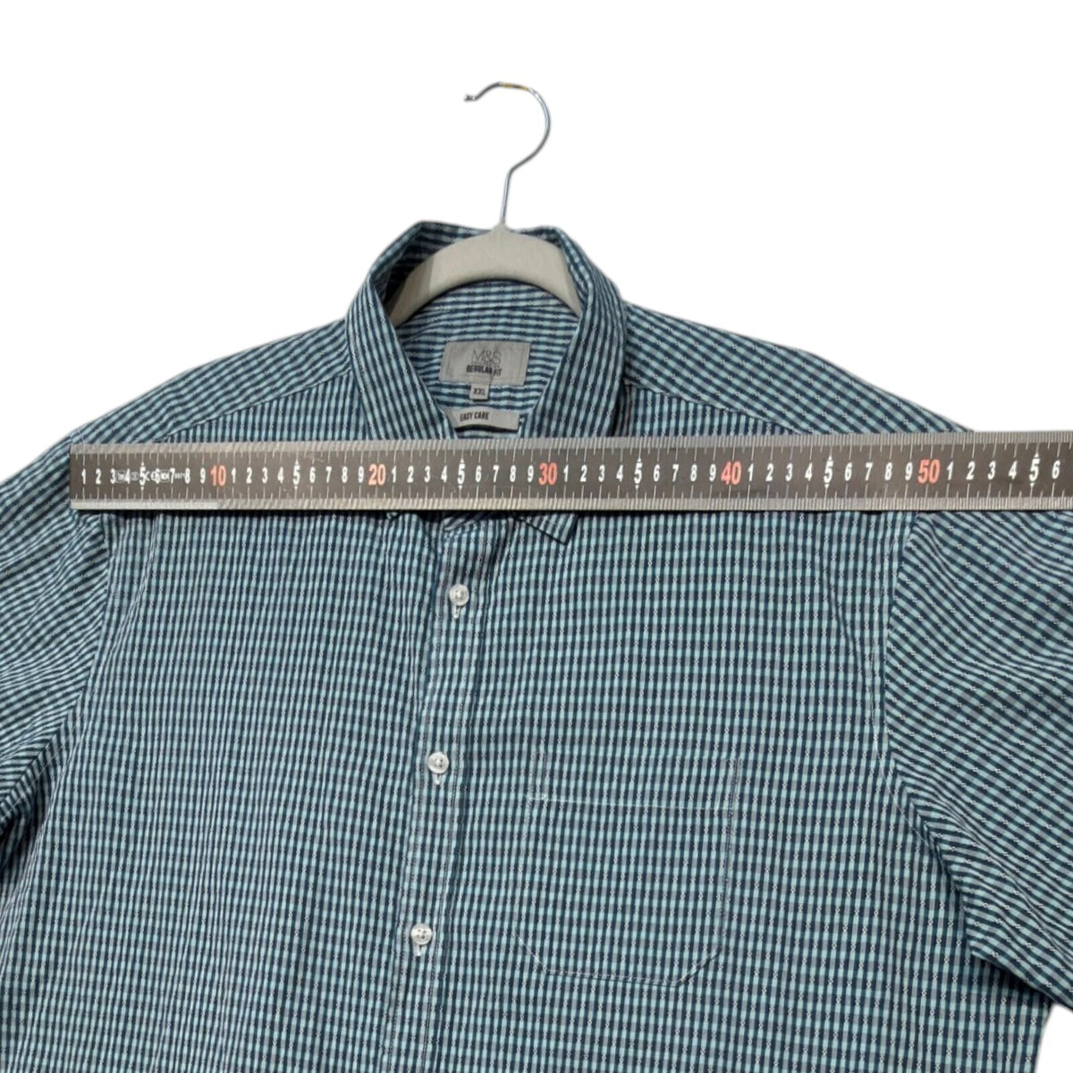 Marks & Spencer blue short sleeve shirt with pocket and subtle patterned design.
