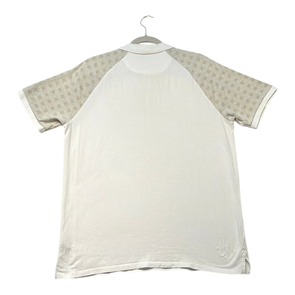 Primark beige zip polo shirt with wing collar and contrasting patterned panels.
