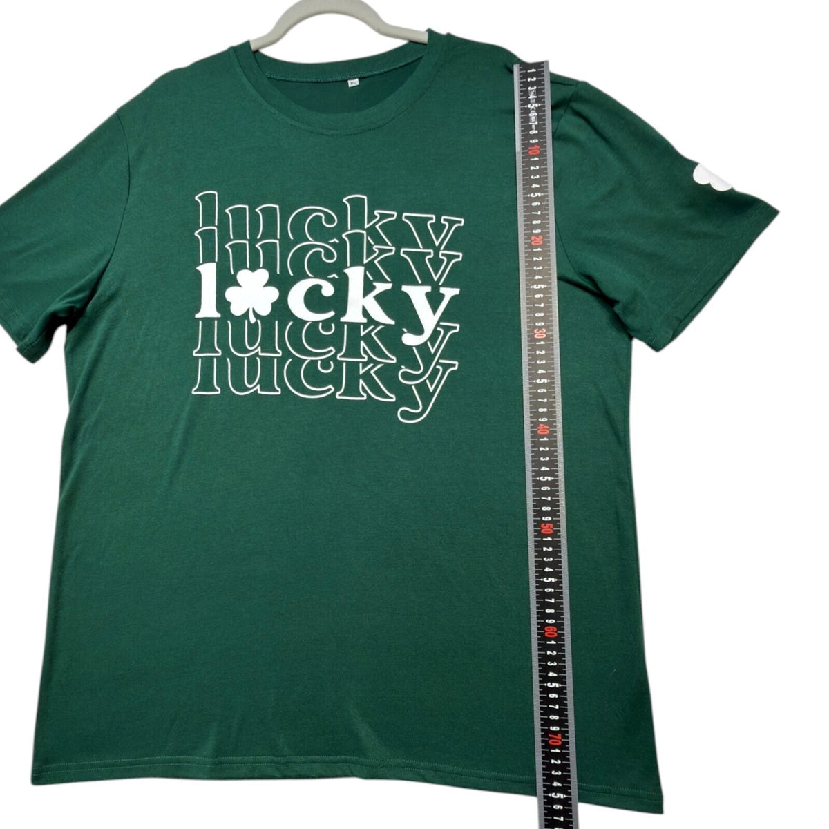 Lucky Star green graphic print t-shirt with repeated lettering and lucky charm design.