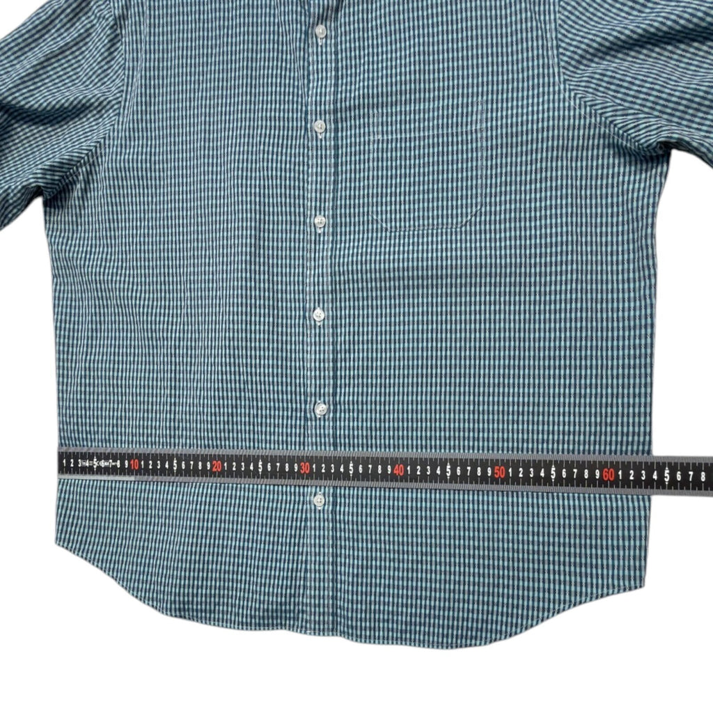 Marks & Spencer blue short sleeve shirt with pocket and subtle patterned design.