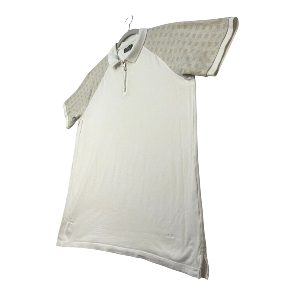 Primark beige zip polo shirt with wing collar and contrasting patterned panels.
