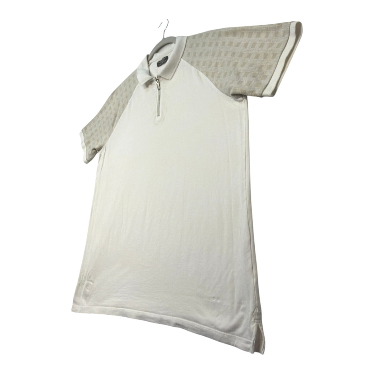 Primark beige zip polo shirt with wing collar and contrasting patterned panels.