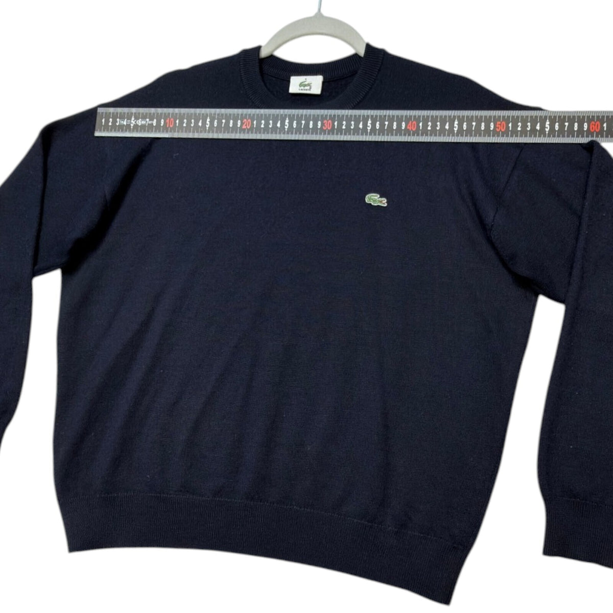 Lacoste blue crewneck sweater long sleeve with embroidered logo and ribbed cuffs.