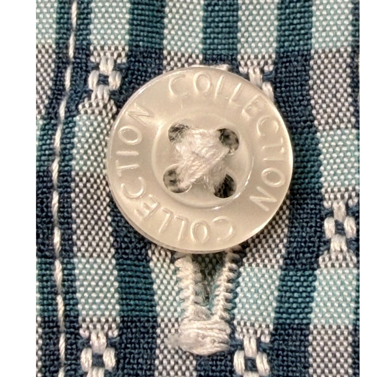 Marks & Spencer blue short sleeve shirt with pocket and subtle patterned design.