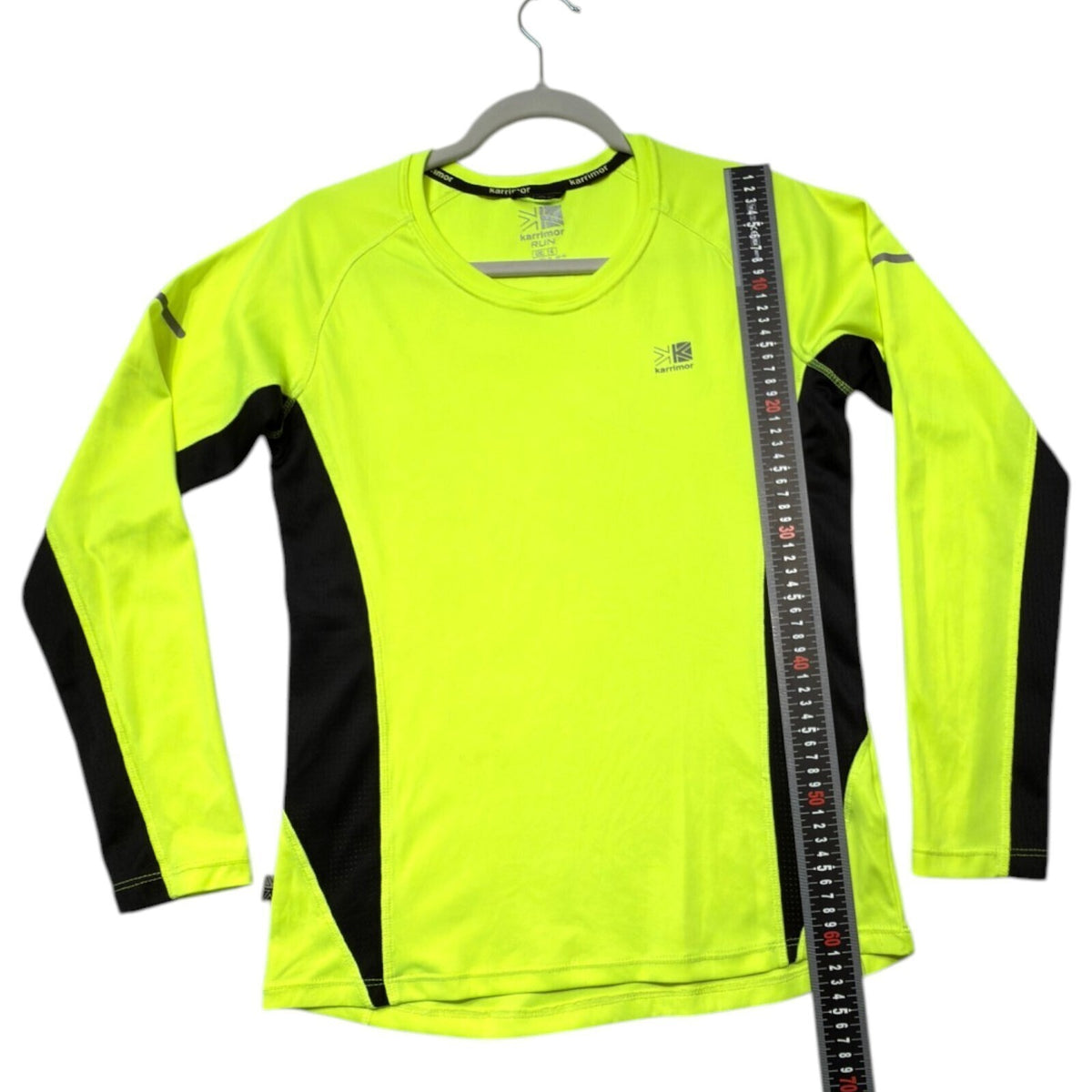 Karrimor yellow long sleeve run top with fluorescent accents and logo detail.