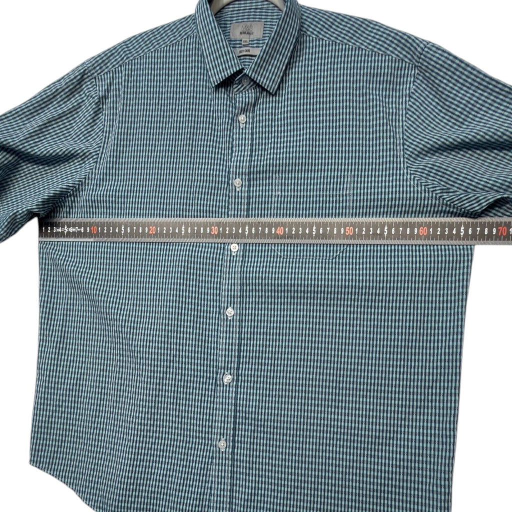 Marks & Spencer blue short sleeve shirt with pocket and subtle patterned design.