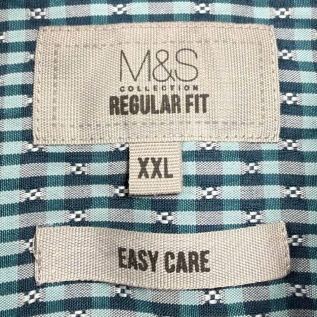 Marks & Spencer blue short sleeve shirt with pocket and subtle patterned design.