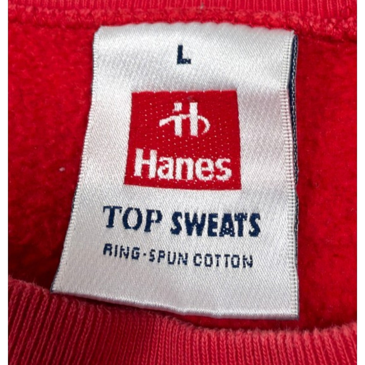 Hanes red crewneck jumper with long sleeves and elasticated cuffs.