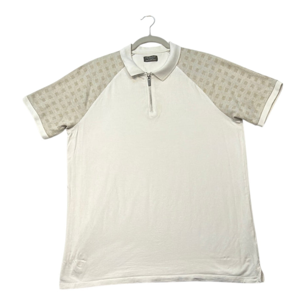 Primark beige zip polo shirt with wing collar and contrasting patterned panels.