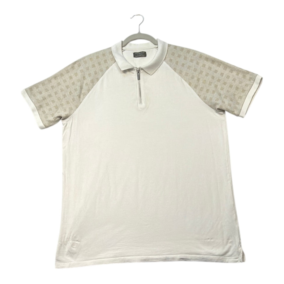 Primark beige zip polo shirt with wing collar and contrasting patterned panels.