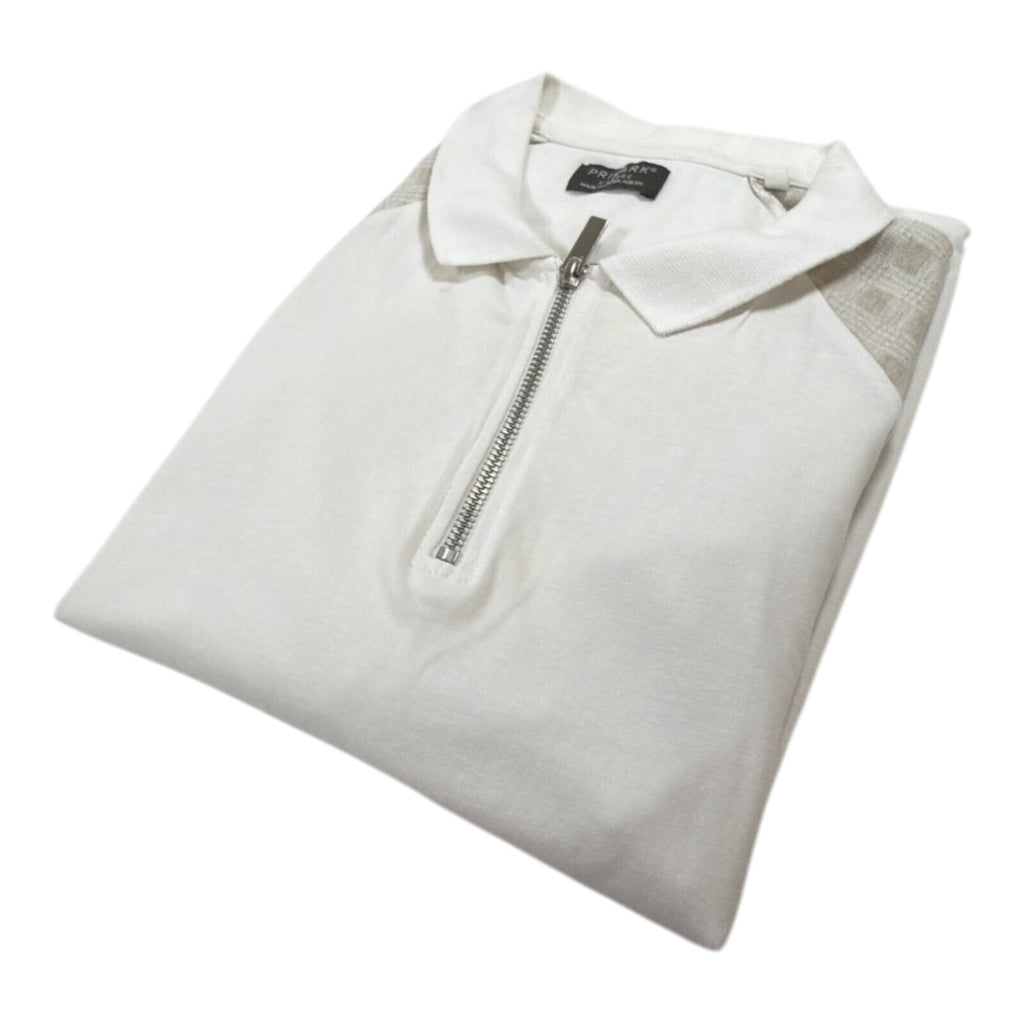 Primark beige zip polo shirt with wing collar and contrasting patterned panels.