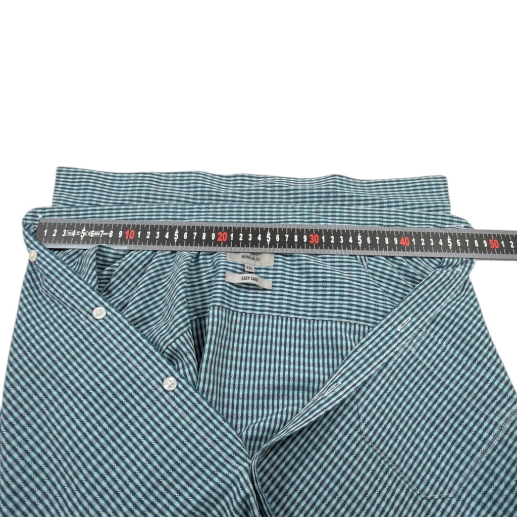 Marks & Spencer blue short sleeve shirt with pocket and subtle patterned design.
