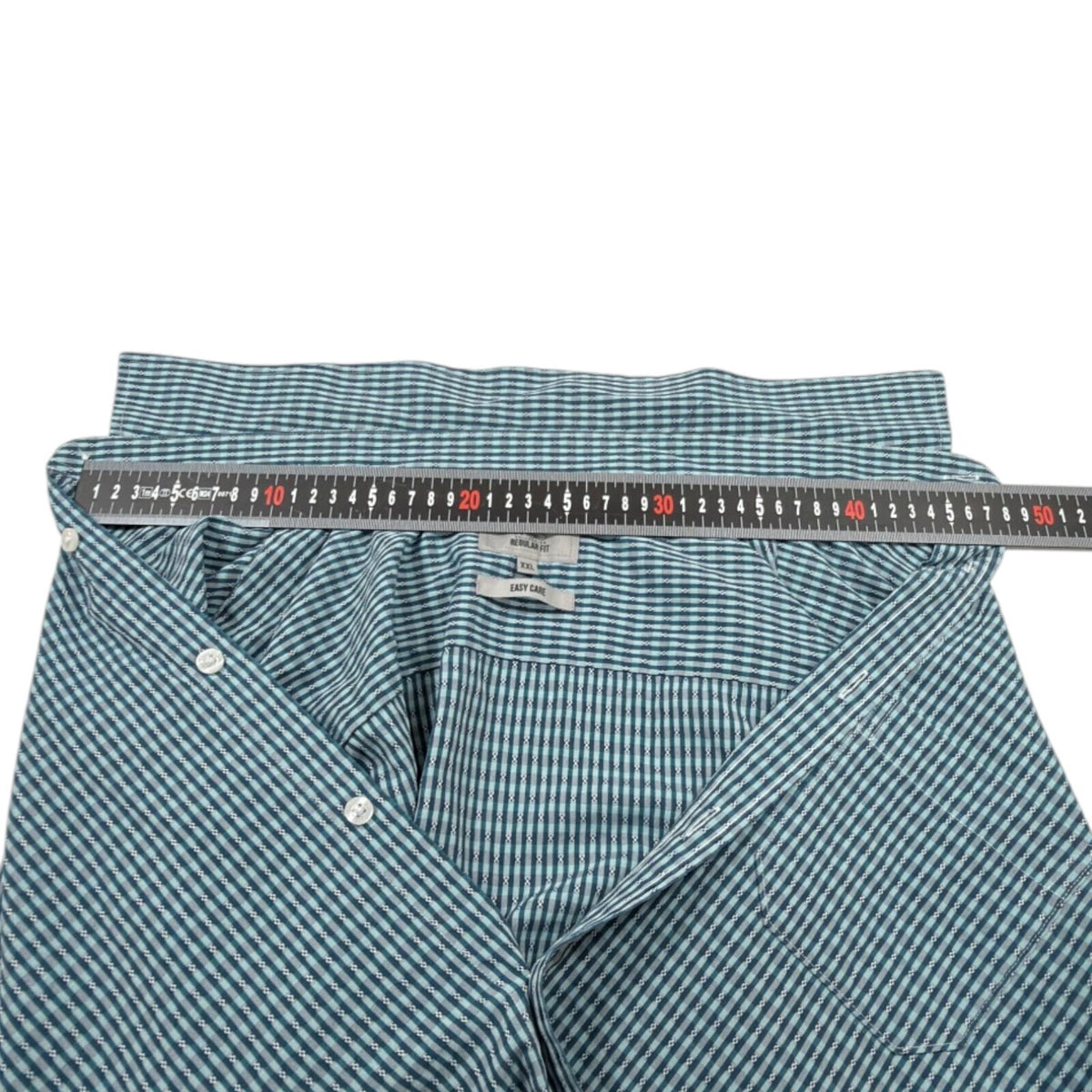 Marks & Spencer blue short sleeve shirt with pocket and subtle patterned design.