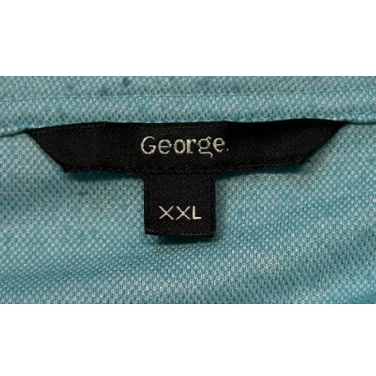 George green polo shirt with pocket, button-down, nature-inspired pattern.