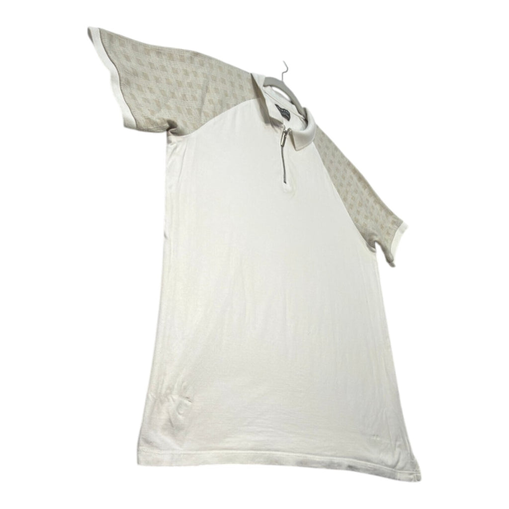 Primark beige zip polo shirt with wing collar and contrasting patterned panels.