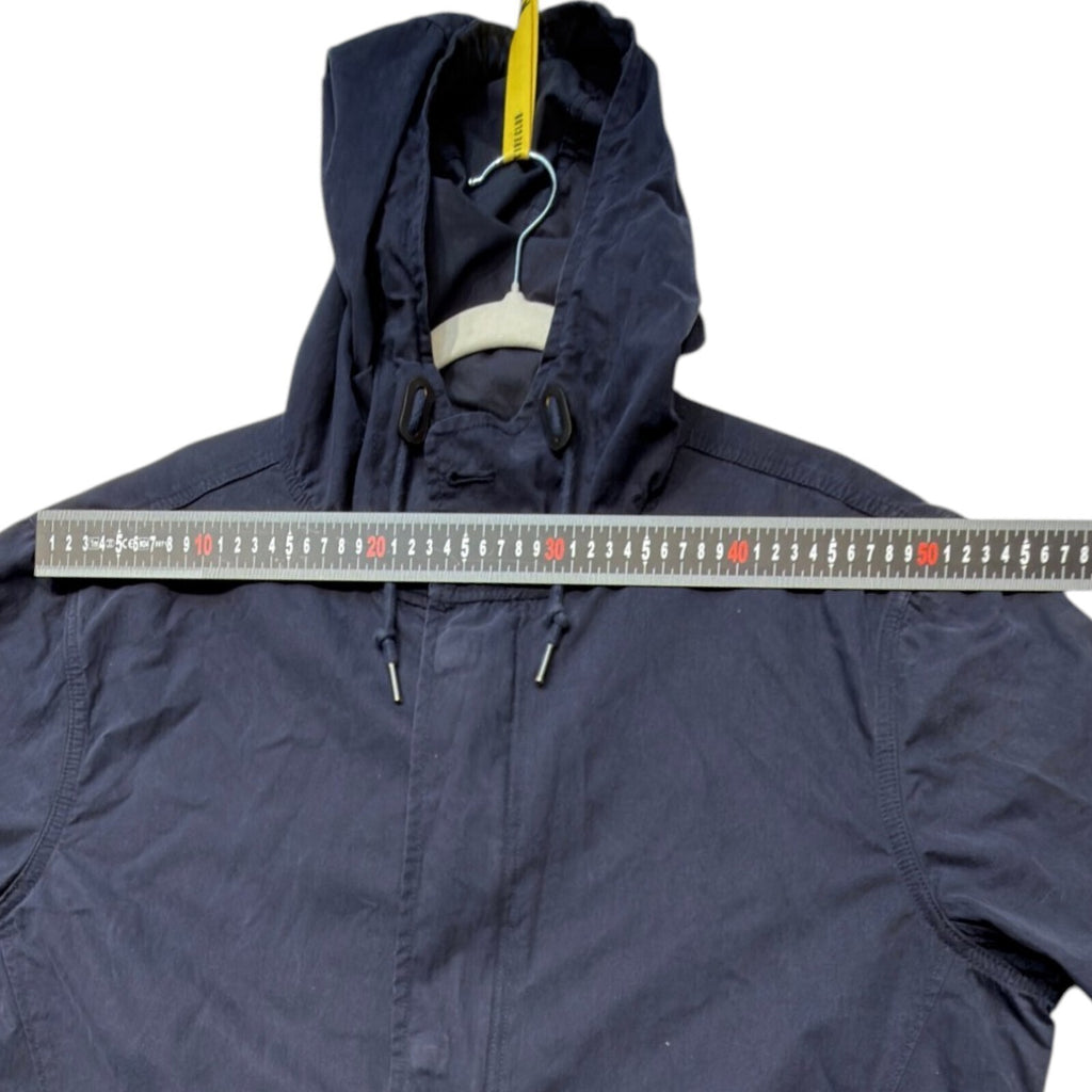 Admiral blue rain coat with drawstring waist, hood, and logo detail.