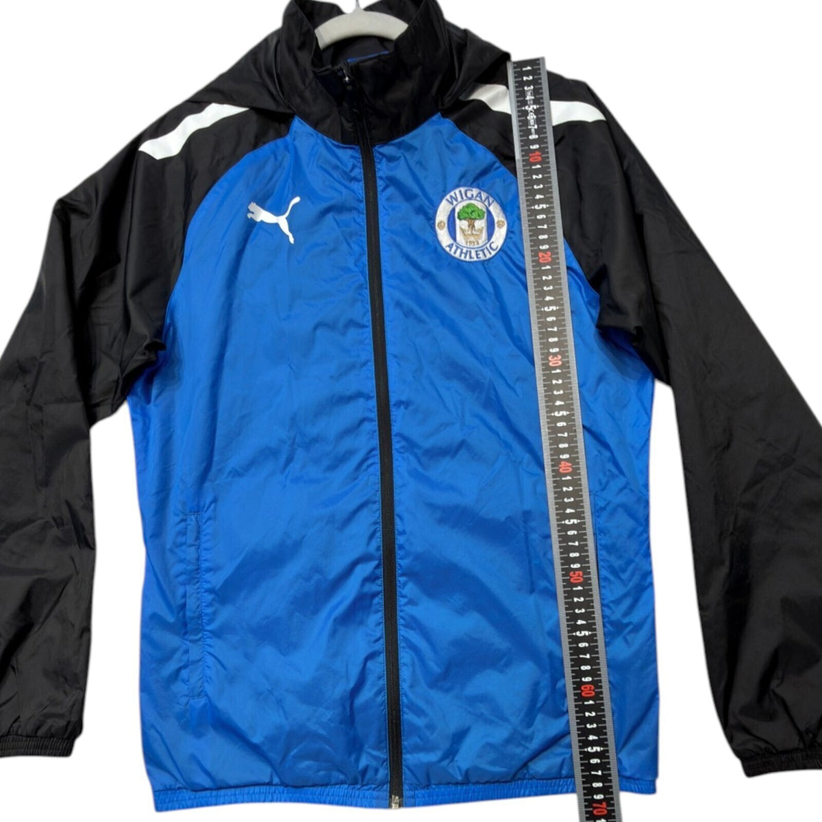 PUMA blue rain jacket full zip with Wigan Athletic logo and long sleeves.