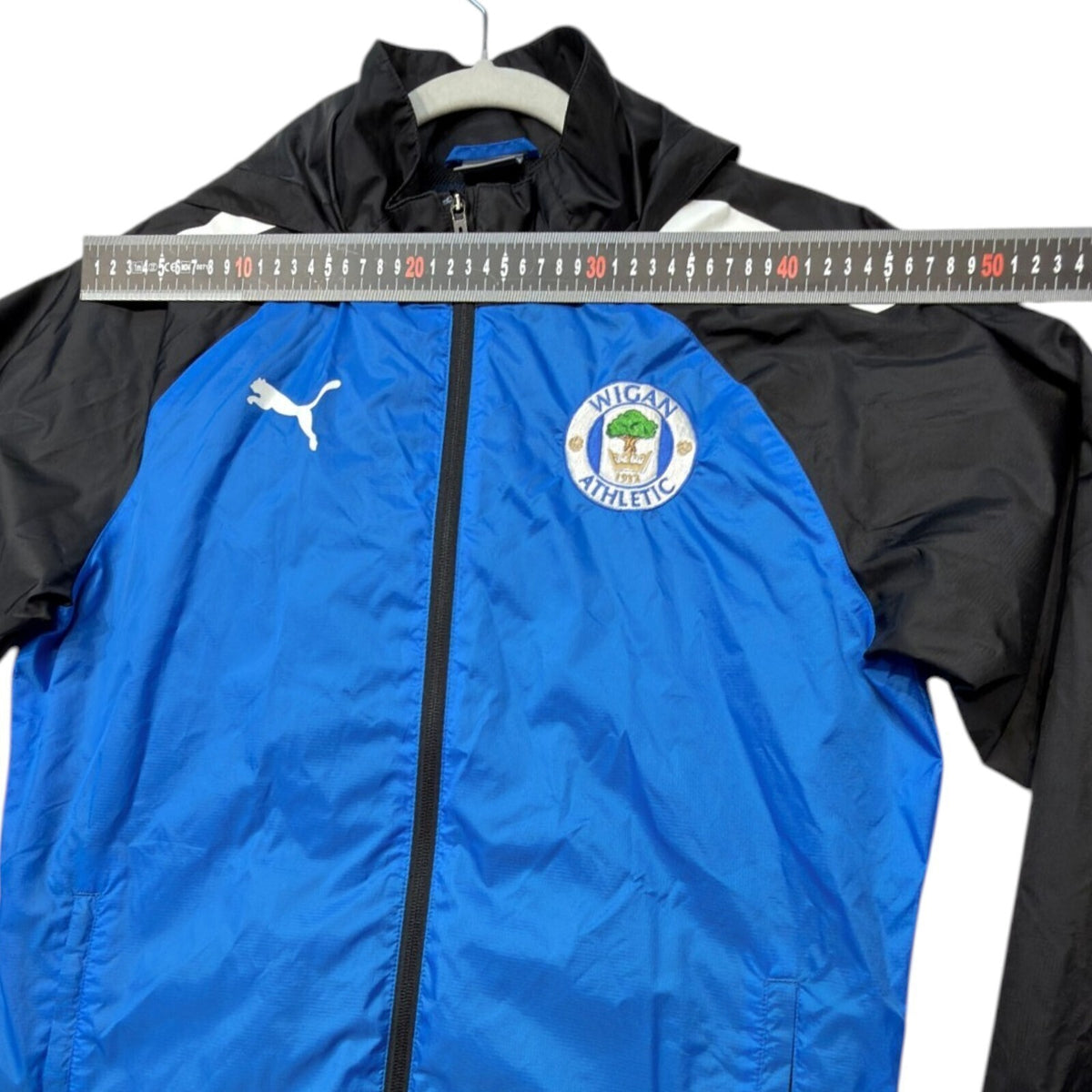 PUMA blue rain jacket full zip with Wigan Athletic logo and long sleeves.