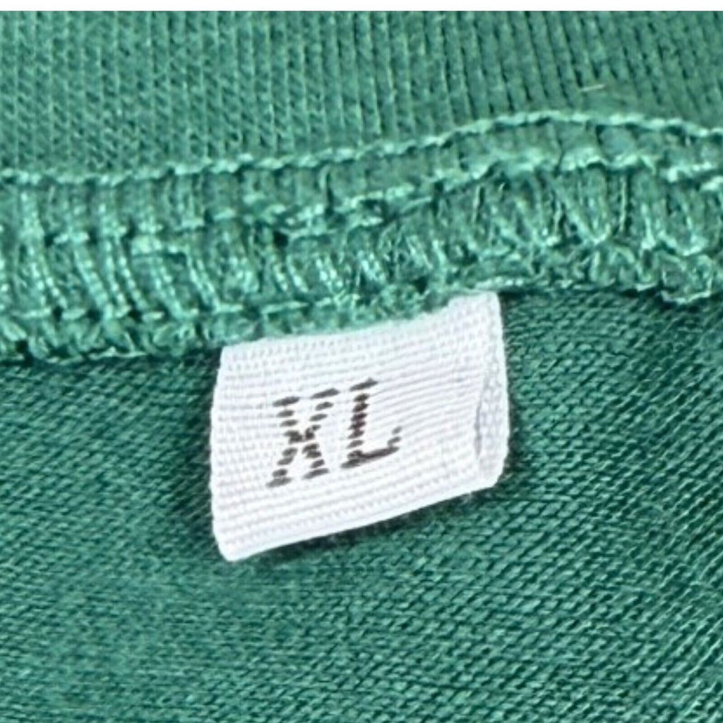 Lucky Star green graphic print t-shirt with repeated lettering and lucky charm design.