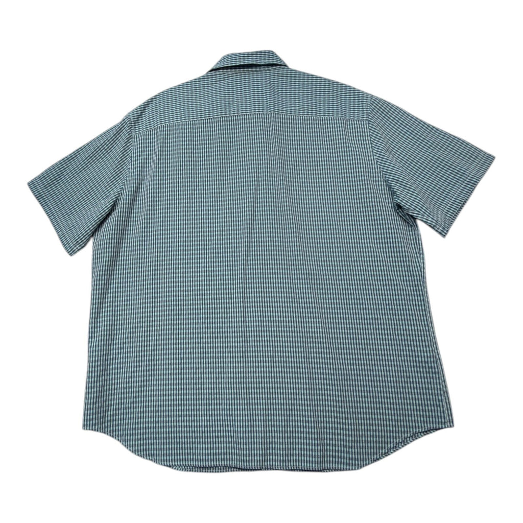 Marks & Spencer blue short sleeve shirt with pocket and subtle patterned design.