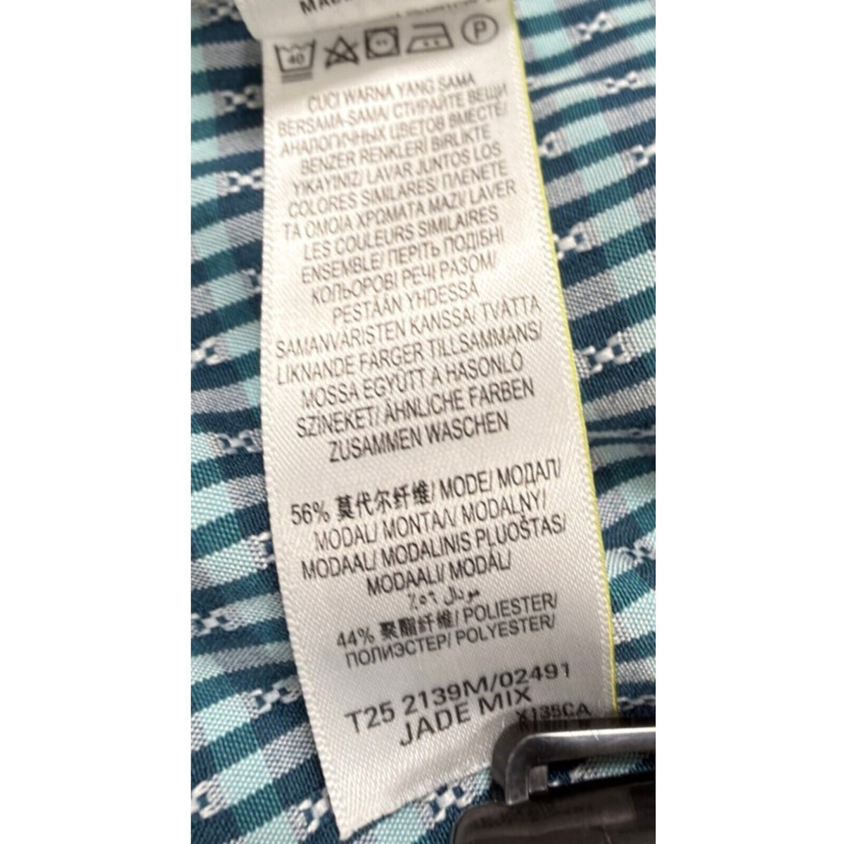 Marks & Spencer blue short sleeve shirt with pocket and subtle patterned design.